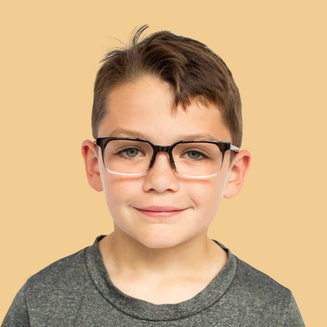 Boy wearing Small (45-15-130) / Black Clear Fade rectangle glasses 