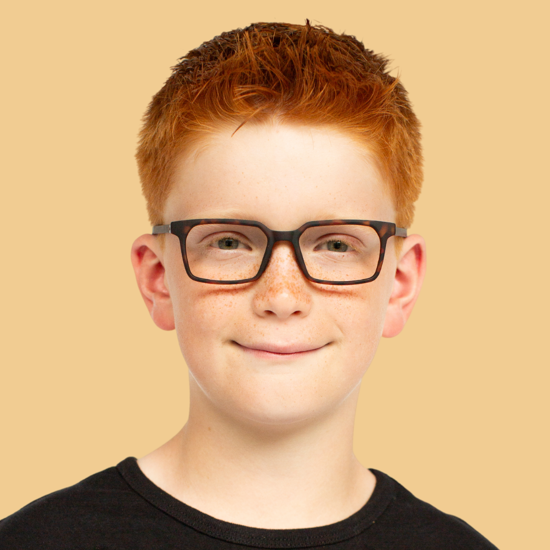 Boy wearing Medium (48-16-135) / Matte Maple Tortoise rectangle glasses 