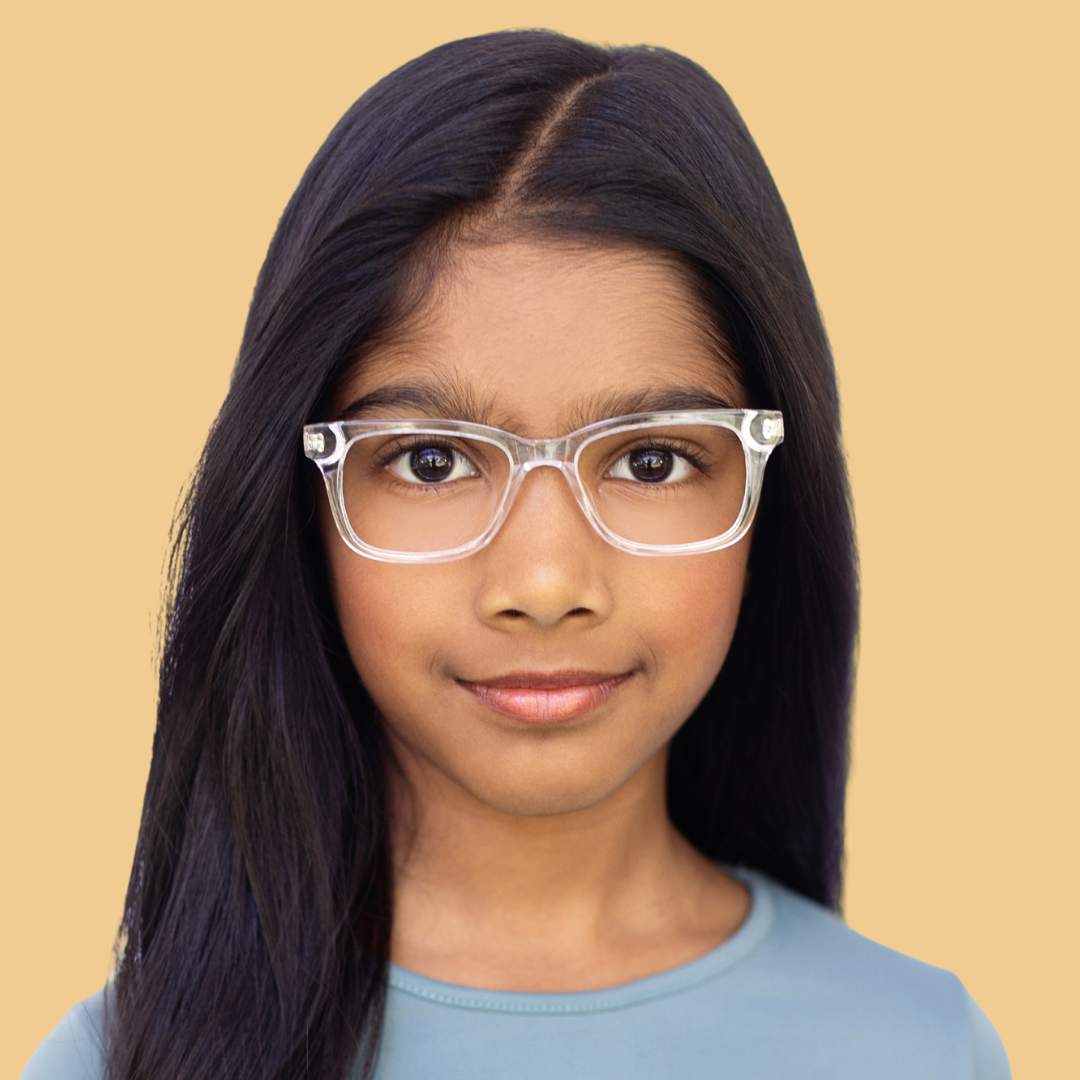 Girl wearing Medium (47-15-130) / Clear Oak rectangle glasses 