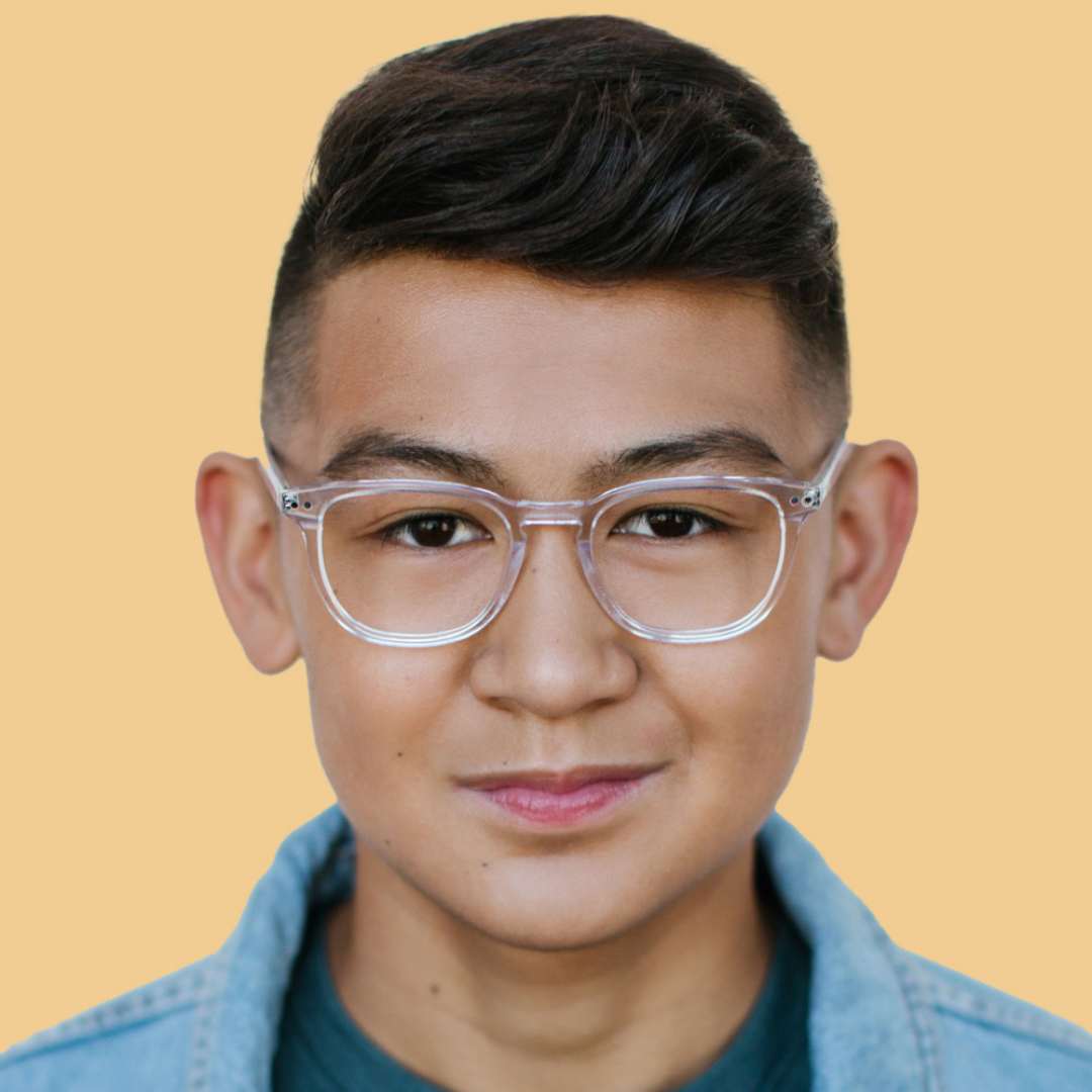 Boy wearing clear square glasses and a blue shirt 