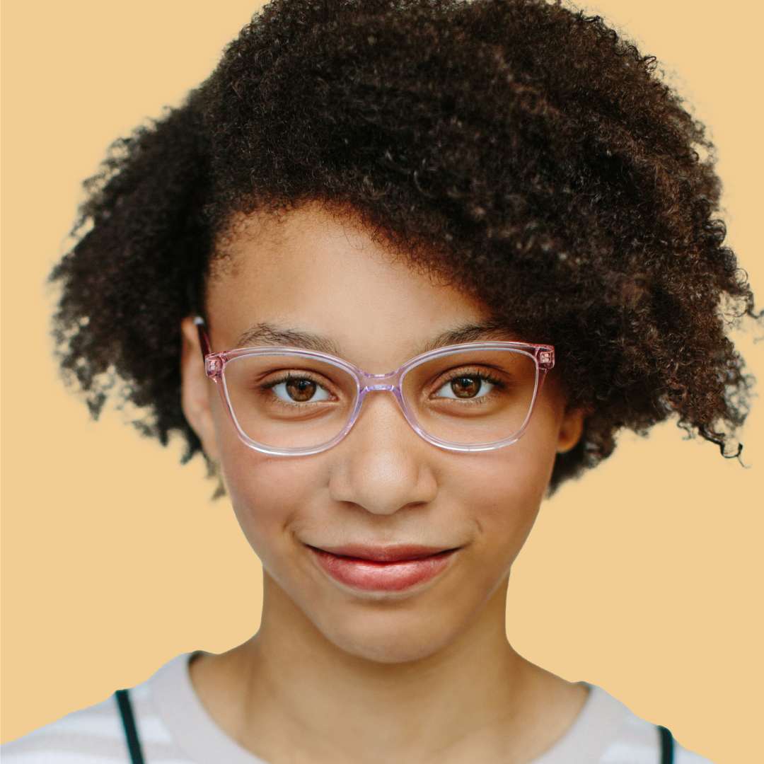 Girl wearing pink cat eye glasses and a beige shirt 