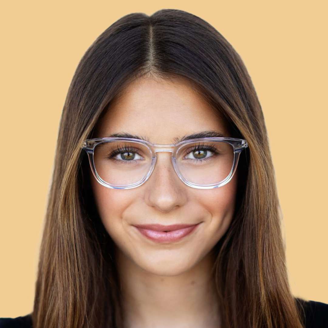 Girl wearing clear square glasses and a black shirt 