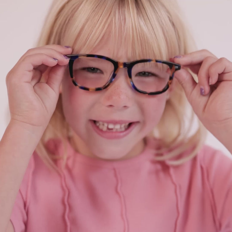 Girl wearing Small (44-17-125) / Lemon Blueberry Tortoise round glasses [color=Lemon Blueberry Tortoise] [ugc=Size Small (Age 4-7)] [child face]