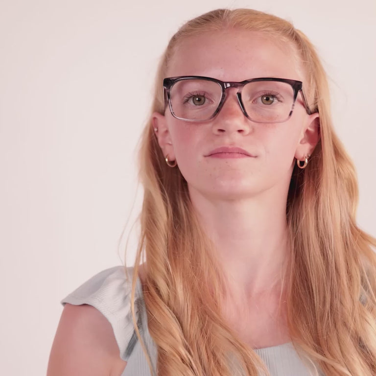 Girl wearing Large (50-17-135) / Striped Black Crystal rectangle glasses [color=Striped Black Crystal] [ugc=Size Large (Age 13-17)] [child face]