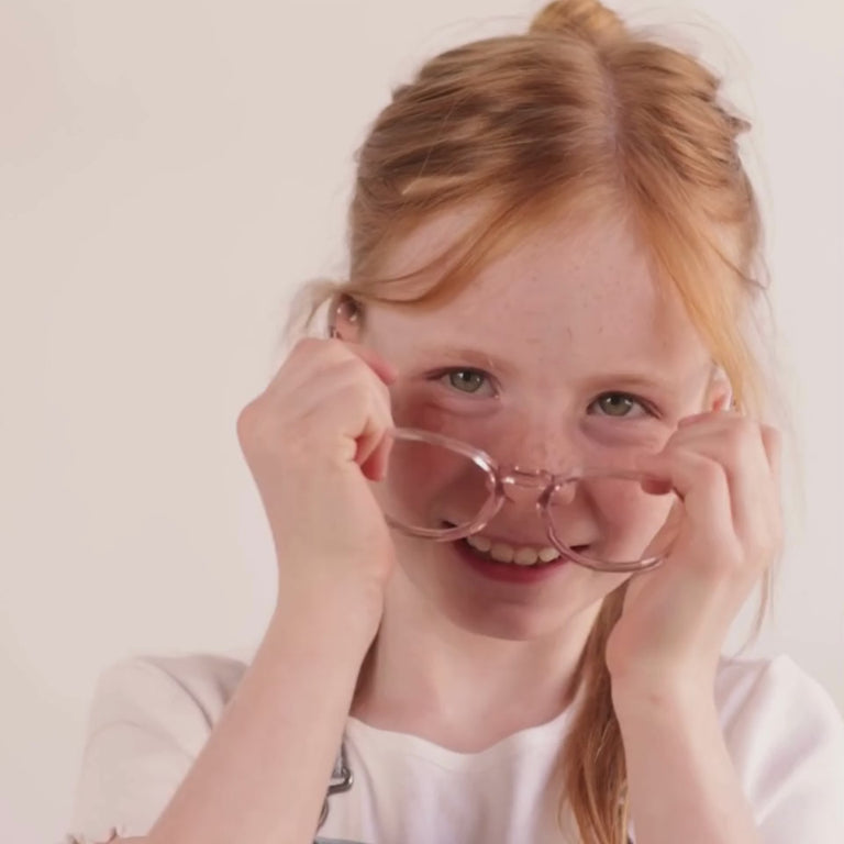 Girl wearing Medium (46-17-130) / Grapefruit round glasses [color=Grapefruit] [size=Medium (46-17-130)][child face]