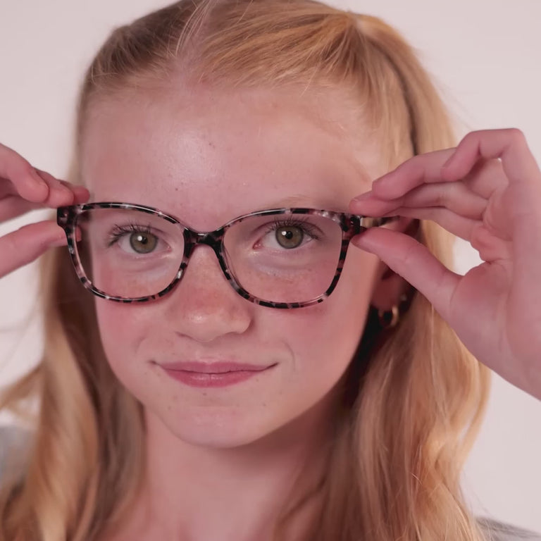 Girl wearing Large (52-15-140) / Rose Gold Tortoise cat eye glasses [variants=39279235792981] [color=Rose Gold Tortoise] [size=Large  (52-15-140)] [child face]