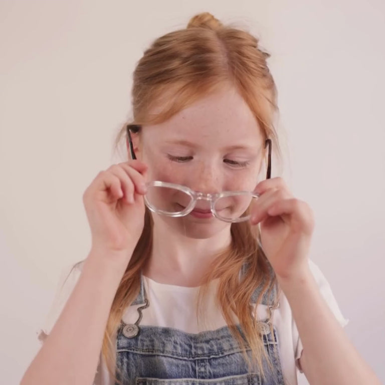 Girl wearing Medium (48-19-130) / Clear Hazelnut Round glasses  [color=Clear Hazelnut] [size=Small (45-19-125)] [child face]