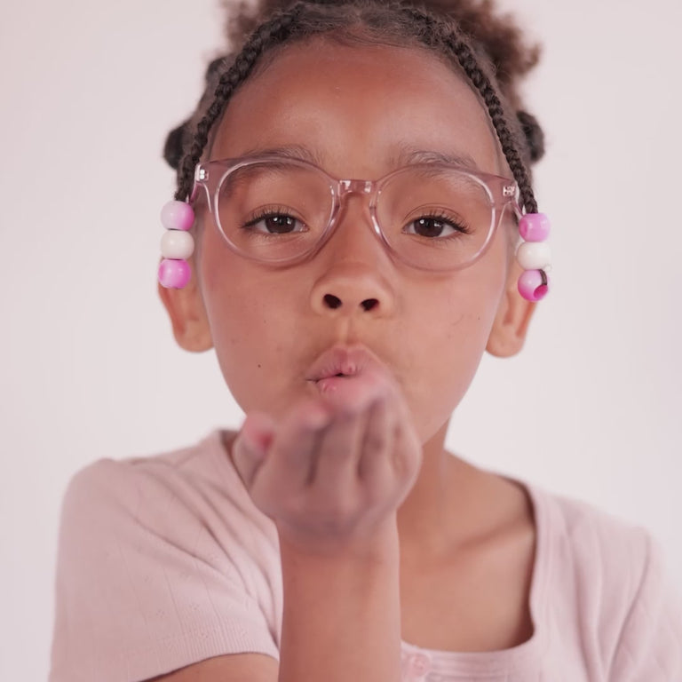 Girl wearing Small (43-15-125) / Grapefruit round glasses [variants=32605031202901, 32605031170133] [color=Grapefruit] [size=Medium (46-16-130), Small (43-15-125)][child face]