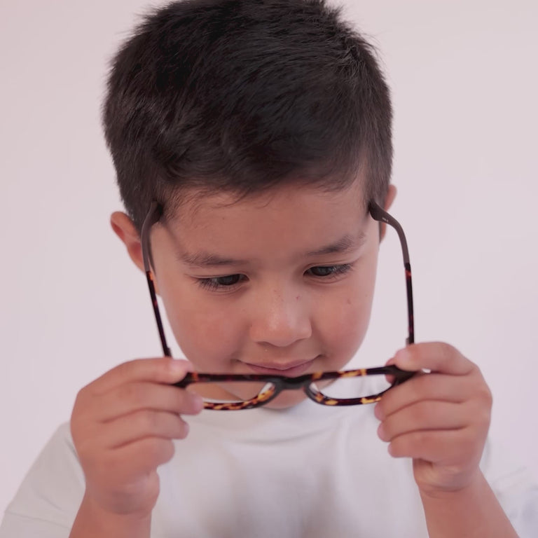 Boy wearing Medium (48-15-130) / Chestnut Tortoise rectangle glasses [color=Chestnut Tortoise] [ugc=Size Small (Age 4-7)] [child face]