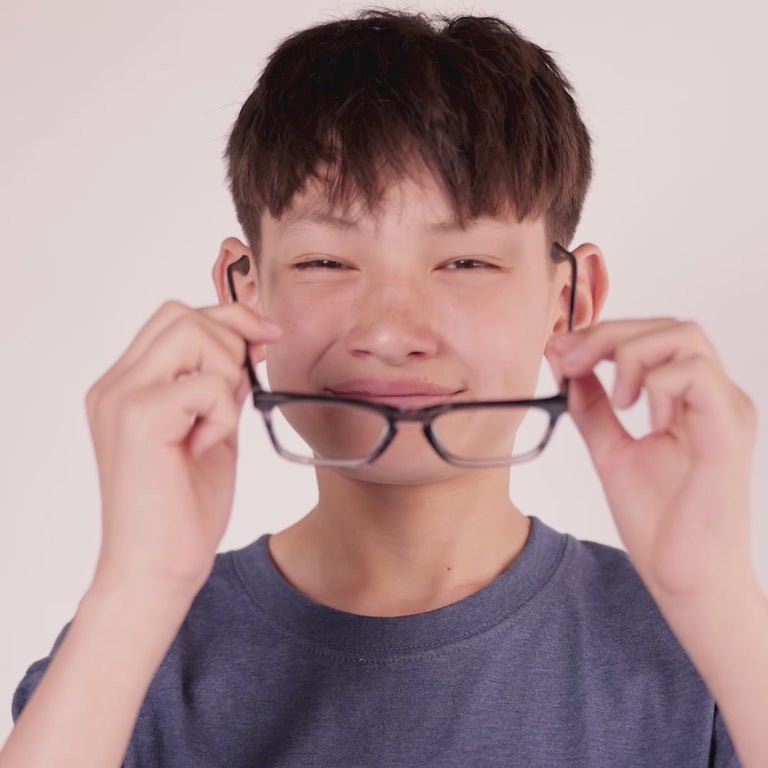 Boy wearing Large (50-17-135) / Striped Black Crystal rectangle glasses [color=Striped Black Crystal] [ugc=Size Large (Age 13-17)] [child face]