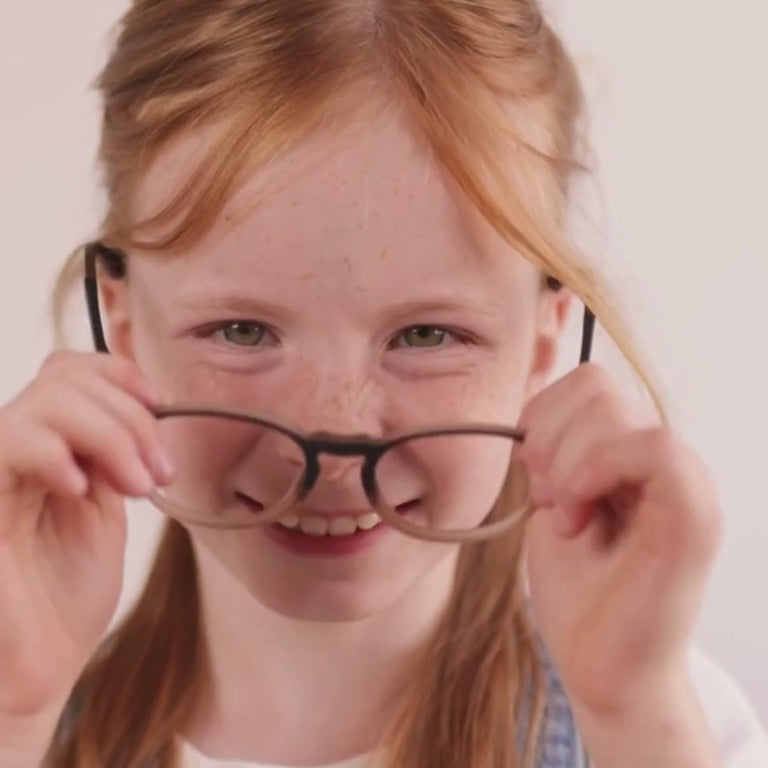 Girl wearing Medium (46-17-130) / Matte Chocolate Fade round glasses  [color=Matte Chocolate Fade] [size=Medium (46-17-130)][child face]