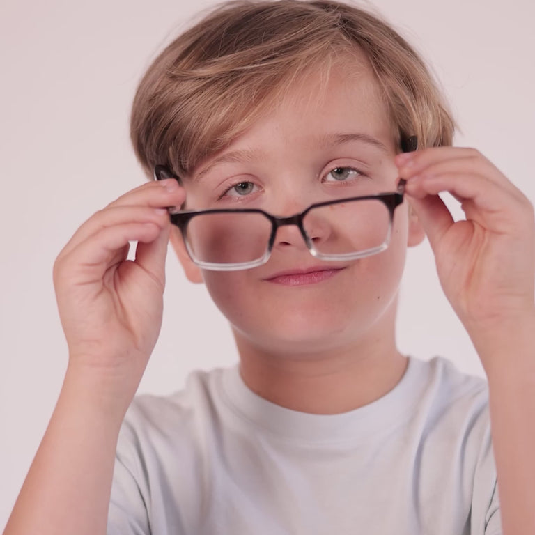Boy wearing Medium (48-16-135) / Black Clear Fade rectangle glasses [color=Black Clear Fade] [ugc=Size Medium (Age 8-12)] [child face]