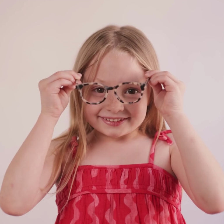 Girl wearing Small (43-15-125) / Cream Tortoise round glasses [color=Cream Tortoise] [size=Small (43-15-125)][child face]