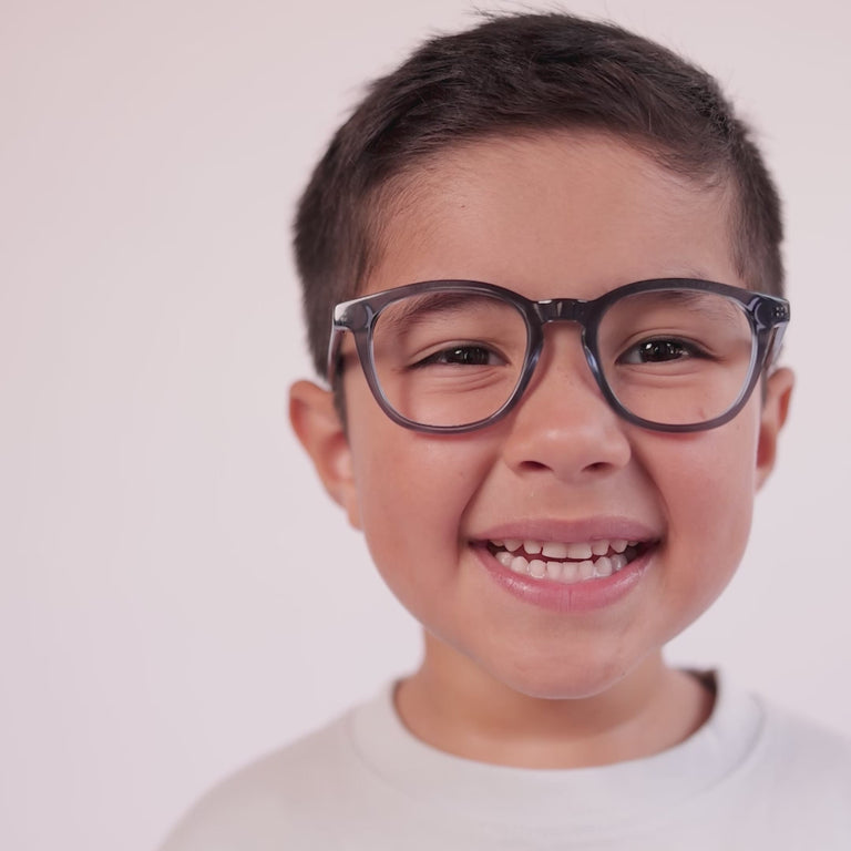 Boy wearing Small (44-18-130 / Indigo Crystal round glasses [variants=41839759917141] [color=Indigo Crystal] [ugc=Size Small (Age 4-7)] [child face]