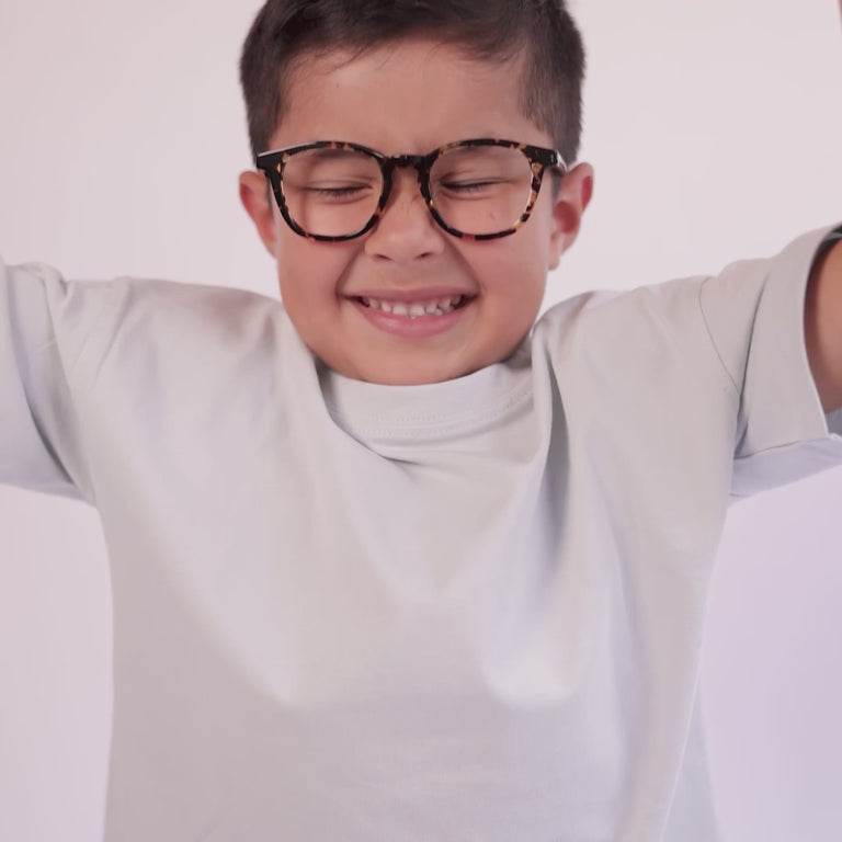 Boy wearing Small (44-18-130 / Havana Tortoise round glasses [variants=41839759884373] [color=Havana Tortoise] [ugc=Size Small (Age 4-7)] [child face]