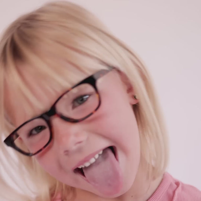 Girl wearing Medium (48-15-130) / Chestnut Tortoise rectangle glasses [variants=22362871562325, 22362871169109] [color=Chestnut Tortoise] [size=Medium (48-15-130), Small (45-15-125)][child face]