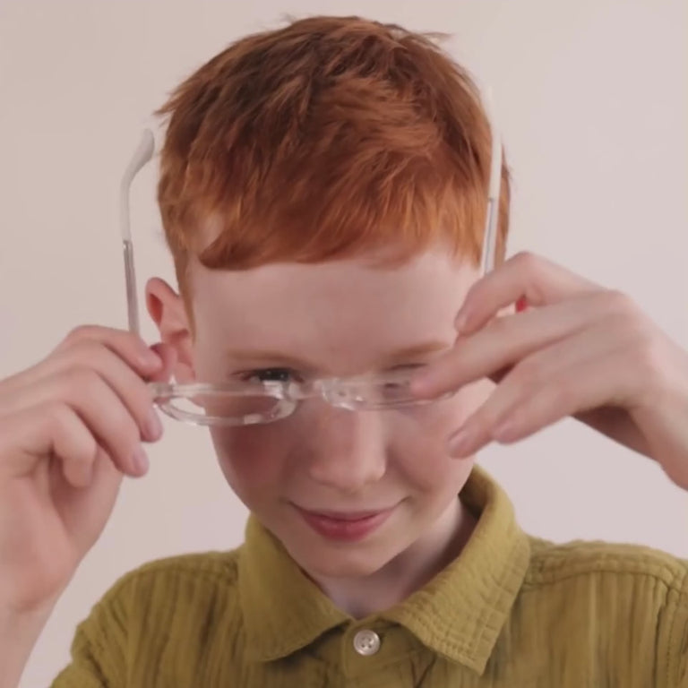 Boy wearing Medium (46-17-130) / Clear square glasses  [variants=40915175866453] [color=Clear] [size=Medium (46-17-130)][child face]
