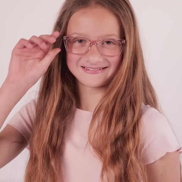 Girl wearing Medium (48-15-130) / Grapefruit rectangle glasses [variants=22362871496789, 22362871103573] [color=Grapefruit] [size=Medium (48-15-130), Small (45-15-125)][child face]