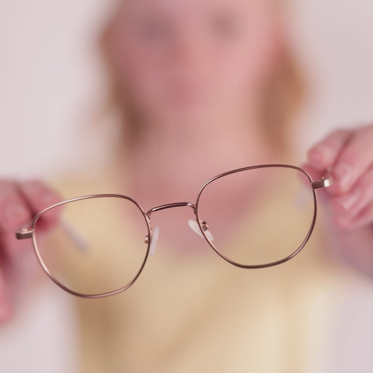 Girl wearing Medium (47-20-140) / Rose Gold round glasses [variants=32660983382101] [color=Rose Gold] [size=Medium (47-20-140)][child face]