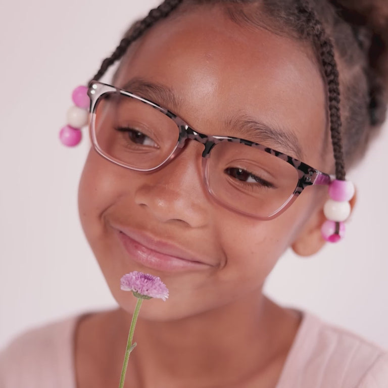 Girl wearing Medium (48-16-130) / Blush Tortoise cat eye glasses [variants=22362878771285, 22362878509141] [color=Blush Tortoise] [size=Medium (48-16-130), Small (45-16-125)][child face]